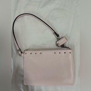 Coach small blush colored wristlet with silver studs